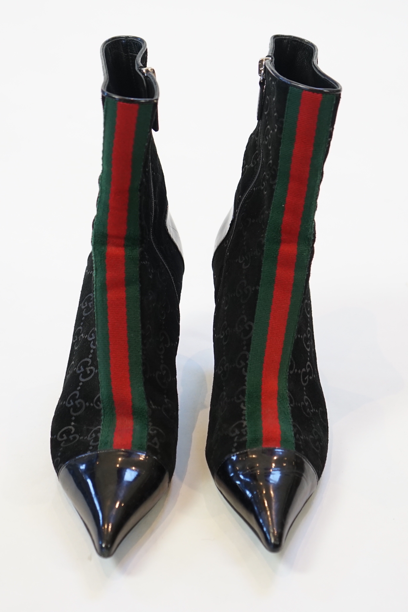 A pair of Gucci monogram pattern and ribbon black lady's suede ankle boots, size EU 38.5